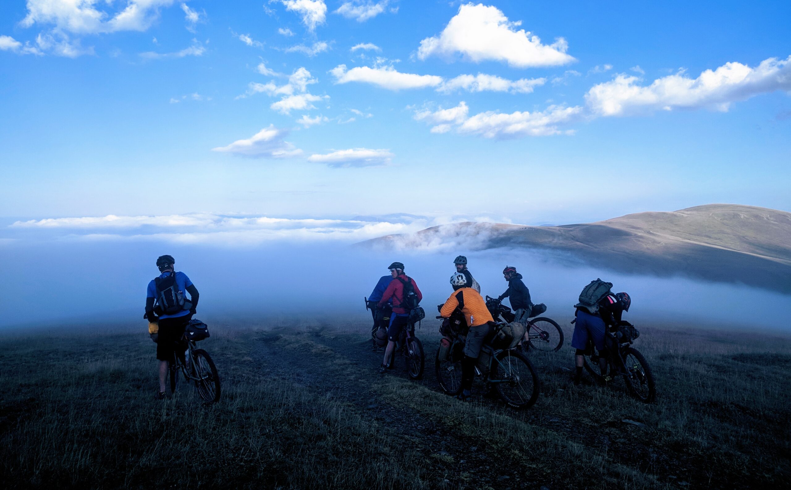 The Bikepacking Armenia 2018 team overlooking a temperature inversion high in the mountains of Armenia