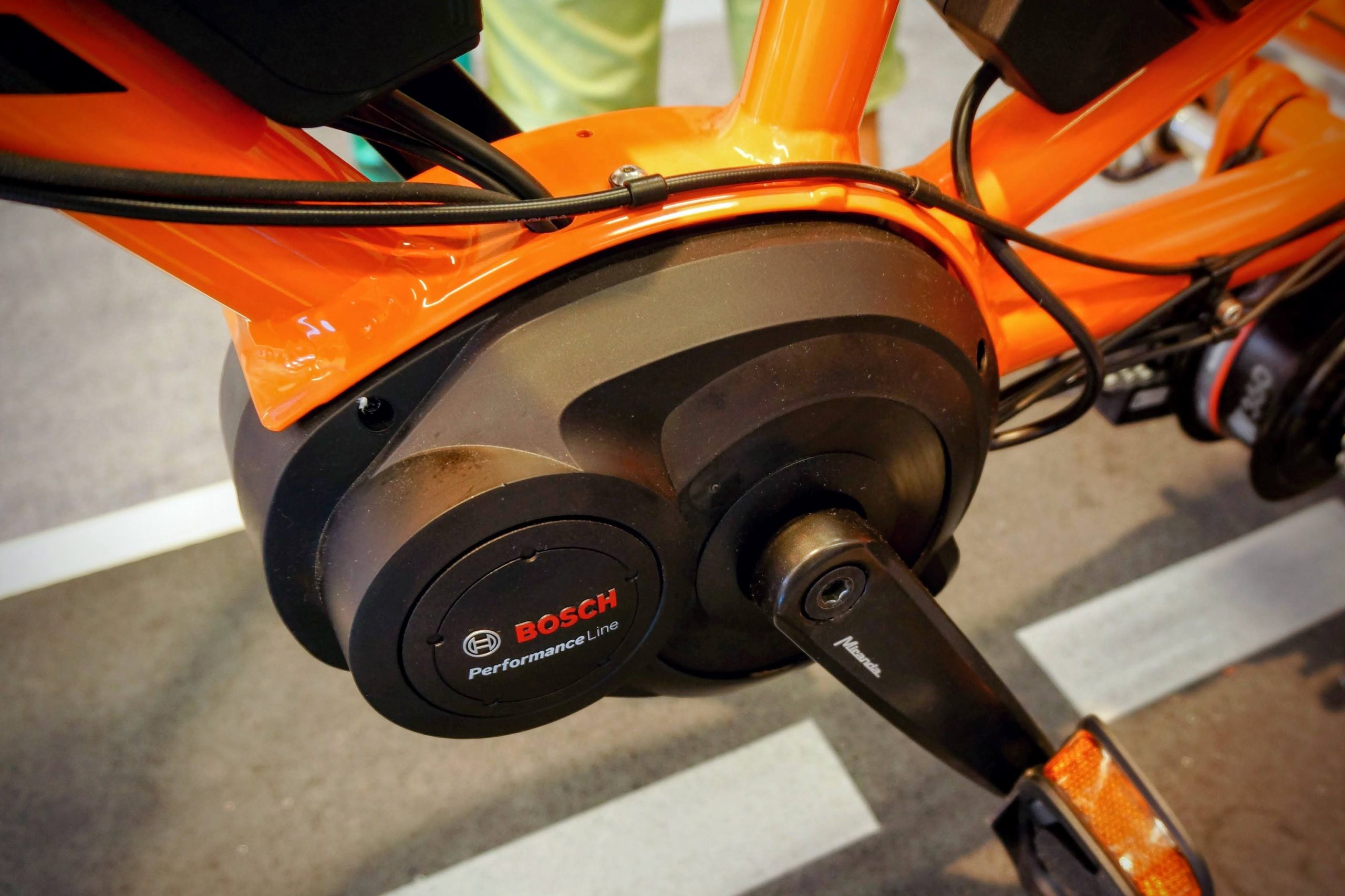 Photo of a Bosch mid-drive electric bicycle motor attached to a purpose-built bike frame.